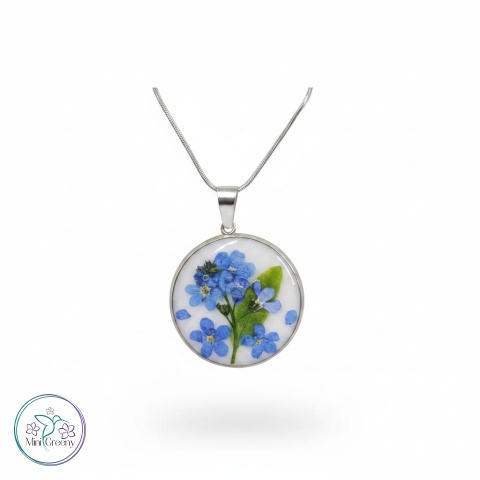 Okrągły wisiorek z niezapominajką